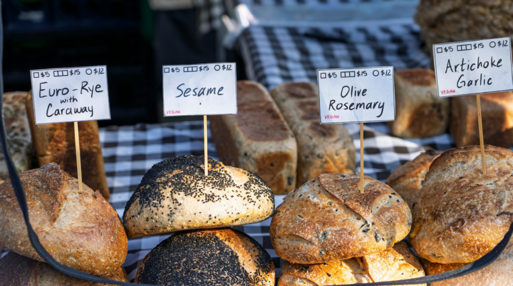 vendor selling bread at farmers market